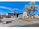 Modern home exterior with a landscaped yard and driveway at 6252 Fairwood Ave, Las Vegas, NV 89107