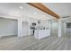 Open concept kitchen with island and wood beam detail at 6252 Fairwood Ave, Las Vegas, NV 89107