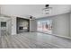 Spacious living room featuring a modern fireplace and sliding glass doors at 6252 Fairwood Ave, Las Vegas, NV 89107