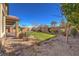 Landscaped backyard with artificial turf and gravel at 6288 Starflare St, Las Vegas, NV 89148