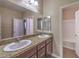 Bathroom with double sinks and granite countertops at 6288 Starflare St, Las Vegas, NV 89148