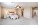 Bright bedroom featuring a ceiling fan and ample space at 6288 Starflare St, Las Vegas, NV 89148