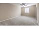 Bright bedroom with ceiling fan and neutral carpeting at 6288 Starflare St, Las Vegas, NV 89148