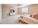 Comfortable bedroom with neutral decor and a large window at 6288 Starflare St, Las Vegas, NV 89148