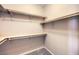 Large walk-in closet with custom shelving and hanging rods at 6288 Starflare St, Las Vegas, NV 89148