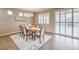 Bright dining room with wood table and access to backyard at 6288 Starflare St, Las Vegas, NV 89148