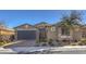 Single-story home with gray garage door and landscaped front yard at 6288 Starflare St, Las Vegas, NV 89148