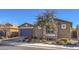 House exterior with gray garage door and stone accents at 6288 Starflare St, Las Vegas, NV 89148