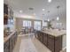 Open kitchen with granite countertops and stainless steel appliances at 6288 Starflare St, Las Vegas, NV 89148