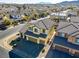 Aerial view of a two-story house in a residential neighborhood at 633 Finch Island Ave, Henderson, NV 89015