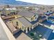 Aerial view of two-story house and surrounding homes at 633 Finch Island Ave, Henderson, NV 89015