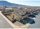 Aerial view of two-story house with mountain backdrop at 633 Finch Island Ave, Henderson, NV 89015