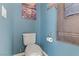 Small bathroom with toilet and blue walls at 633 Finch Island Ave, Henderson, NV 89015