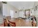 Dining area with a wooden table and chairs, overlooking the living room at 633 Finch Island Ave, Henderson, NV 89015