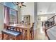 Dining room features a wood table, bench seating, and hardwood floors at 633 Finch Island Ave, Henderson, NV 89015