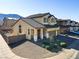 Two-story house with desert landscaping and attached garage at 633 Finch Island Ave, Henderson, NV 89015