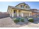 Two-story house with a landscaped yard and two-car garage at 633 Finch Island Ave, Henderson, NV 89015