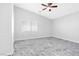 Well-lit bedroom featuring a window with blinds and ceiling fan at 6637 Lookout Lodge Ln # 2, North Las Vegas, NV 89084