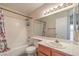 Simple bathroom with shower/tub combo, vanity, and mirror at 6861 Tamarus St # 203, Las Vegas, NV 89119