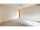 Simple bedroom with laminate flooring and access to bathroom at 6861 Tamarus St # 203, Las Vegas, NV 89119