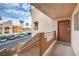 Condo entryway with brown door and view of parking lot at 6861 Tamarus St # 203, Las Vegas, NV 89119