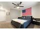 Spacious bedroom with a large bed and American flag wall decor at 7336 Young Doe Ave, Las Vegas, NV 89130