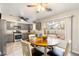 Kitchen with gray cabinets, granite countertops, and a dining area at 7336 Young Doe Ave, Las Vegas, NV 89130