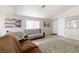 Bright living room with hardwood floors and neutral-toned furniture at 7336 Young Doe Ave, Las Vegas, NV 89130