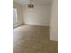 Dining area with tile floors and a chandelier at 7509 W Gilmore Ave, Las Vegas, NV 89129