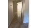 Clean hallway with tile flooring and access to other rooms at 7509 W Gilmore Ave, Las Vegas, NV 89129