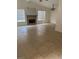 Spacious living room with tile floors, fireplace and lots of natural light at 7509 W Gilmore Ave, Las Vegas, NV 89129