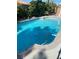 Relaxing blue pool with surrounding concrete at 7509 W Gilmore Ave, Las Vegas, NV 89129