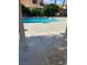 Inviting kidney-shaped pool in the backyard at 7509 W Gilmore Ave, Las Vegas, NV 89129