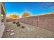 Landscaped backyard with gravel and block wall at 7824 Homing Pigeon St, North Las Vegas, NV 89084