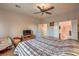 Spacious bedroom with a ceiling fan and en-suite bathroom access at 7824 Homing Pigeon St, North Las Vegas, NV 89084