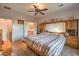 Large bedroom with a king-size bed and built-in wooden headboard at 7824 Homing Pigeon St, North Las Vegas, NV 89084