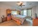 Primary bedroom with a built-in headboard and a ceiling fan at 7824 Homing Pigeon St, North Las Vegas, NV 89084