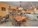 Bright dining room with a large wooden table and chairs at 7824 Homing Pigeon St, North Las Vegas, NV 89084