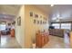 Hallway with a wooden cabinet and pictures on the wall at 7824 Homing Pigeon St, North Las Vegas, NV 89084