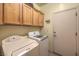 Laundry room with washer, dryer, and additional storage at 7824 Homing Pigeon St, North Las Vegas, NV 89084