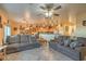 Living room with two couches, a ceiling fan, and views into the kitchen and dining areas at 7824 Homing Pigeon St, North Las Vegas, NV 89084