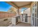 Outdoor kitchen with stainless steel appliances at 7824 Homing Pigeon St, North Las Vegas, NV 89084