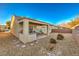 Covered patio with built-in grill and seating area at 7824 Homing Pigeon St, North Las Vegas, NV 89084