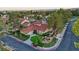 An aerial view of a community showcasing the beautiful landscaping and red-tiled roofs, creating a picturesque setting at 8199 Pinnacle Peak Ave, Las Vegas, NV 89113