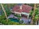 An aerial view of the backyard with an in-ground pool, spa, patio, and lush landscaping at 8199 Pinnacle Peak Ave, Las Vegas, NV 89113