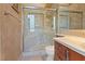 Updated bathroom with a walk-in shower and tiled walls at 8199 Pinnacle Peak Ave, Las Vegas, NV 89113