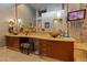 Large bathroom with dual vanities, vessel sinks, and a stone accent wall at 8199 Pinnacle Peak Ave, Las Vegas, NV 89113