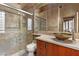 Bathroom with a glass door shower, and wood cabinets at 8199 Pinnacle Peak Ave, Las Vegas, NV 89113