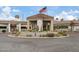 Elegant clubhouse entrance with landscaping and flag at 8199 Pinnacle Peak Ave, Las Vegas, NV 89113