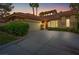 Home with driveway and landscaping at dusk at 8199 Pinnacle Peak Ave, Las Vegas, NV 89113